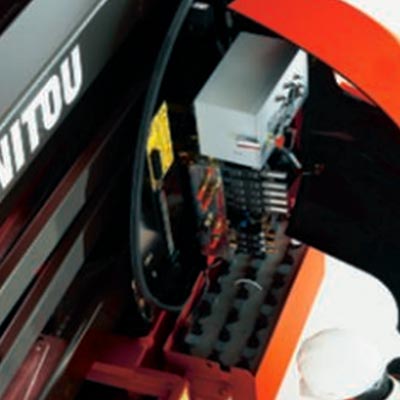 Picture showing an operator performing maintenance on a Manitou Access Lift